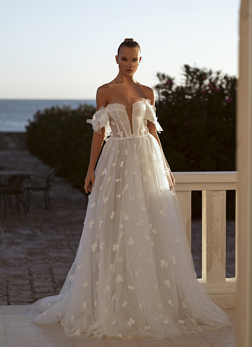 Bride in a wedding dress on the beach background